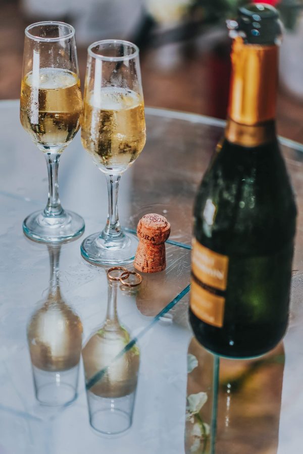 Two glasses next to open champagne bottle (image courtesy of sergio souza)